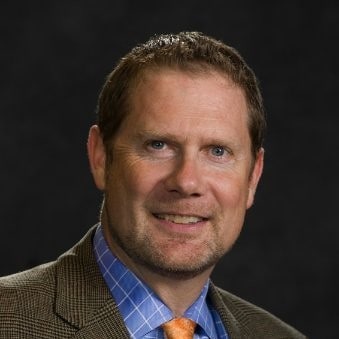 professional man smiling at camera
